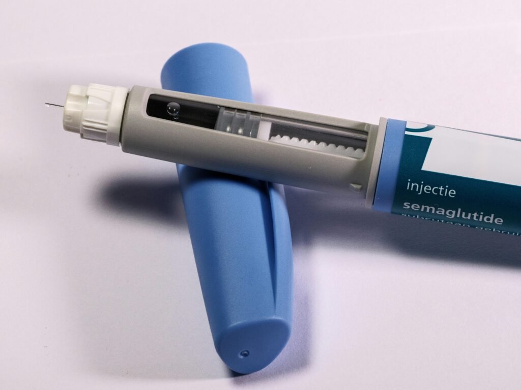 pexels photo 32532049 32532049 idothelookingcom Detailed view of a semaglutide injection pen commonly used for diabetes treatment on a plain background